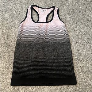 Purple, gray, and black striped gradient workout top